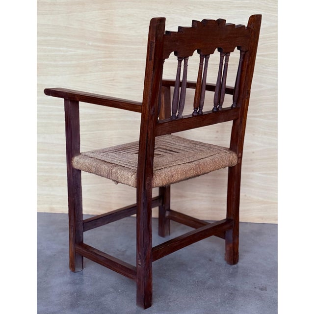 20th century pair of Catalan armchairs in carved walnut and caned seats. Country chairs. Height from the floor to the...