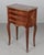 A Louis XVI style marble top marquetry nightstand, or side table, made of veneers of mahogany, walnut and exotics woods...