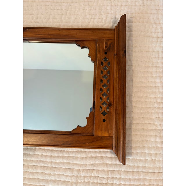 Pennsylvania House solid cherry wood hallway pier mirror from the late 20th century. This mirror has an architectural...