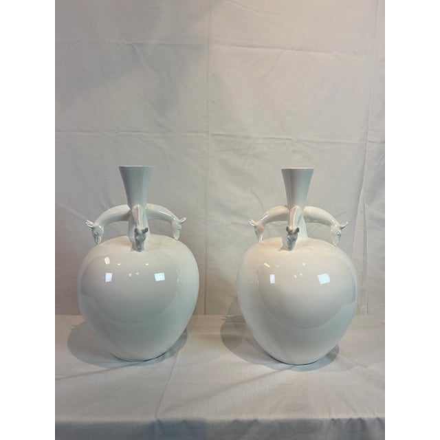 Pair of Contemporary resin vase featuring a horse head motif in a pure white color.