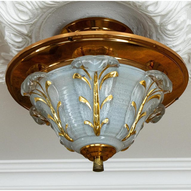 French Art Deco ceiling light, circa 1930s. Elegant ceiling light featuring a molded frosted glass shade with floral...