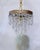 This exceptional mid-century chandelier is an absolute jewel box of light, capturing the dramatic, high-glamour aesthetic...