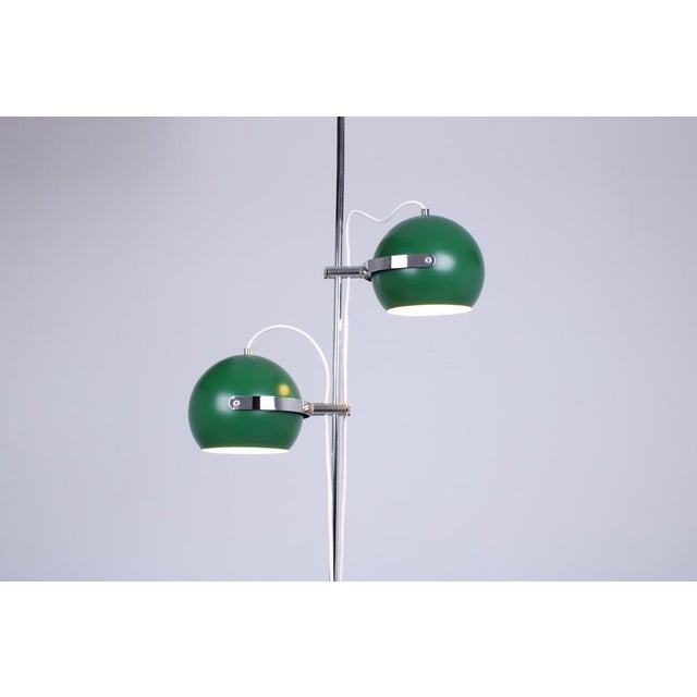 Adjustable genuin seventies double 'Eye Ball' metal floor light. Dutch origin, but clearly 1970ies modernist Italian pop...