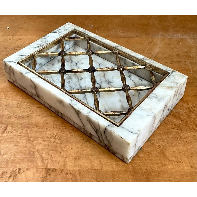 This vintage marble and brass dresser tray beautifully exemplifies the refined elegance of mid-century decorative...