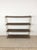 This classic mid century modern bookcase features four metal shelves with original brown paint and faux walnut print,...
