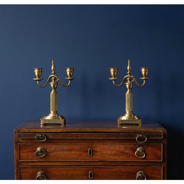 Pair of Antique Swedish brass candlesticks in a Neoclassical Gustavian manner. Circa 1900. Stamped marks. Skultuna Bruk...