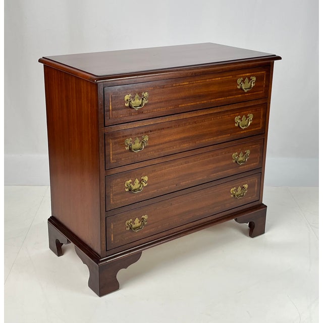 Crafted by the renowned White Furniture Company of Mebane, NC, this fine Chippendale-style chest showcases exceptional...