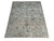 Muted lavender flowers and deep teal accents decorate the ivory field of this handmade Oushak wool rug. Fine taupe vines...