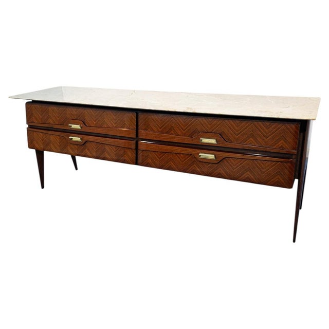 This elegant chest of drawers, likely manufactured by La Permanente Mobili Cantù, is an excellent example of the...