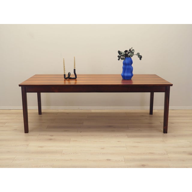The table was made in the 1970s, Danish production. The structure and tabletop are covered with veneer. The legs are made...