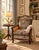This handsome traditional lounge chair combines timeless craftsmanship with inviting comfort. Crafted with a rich dark...