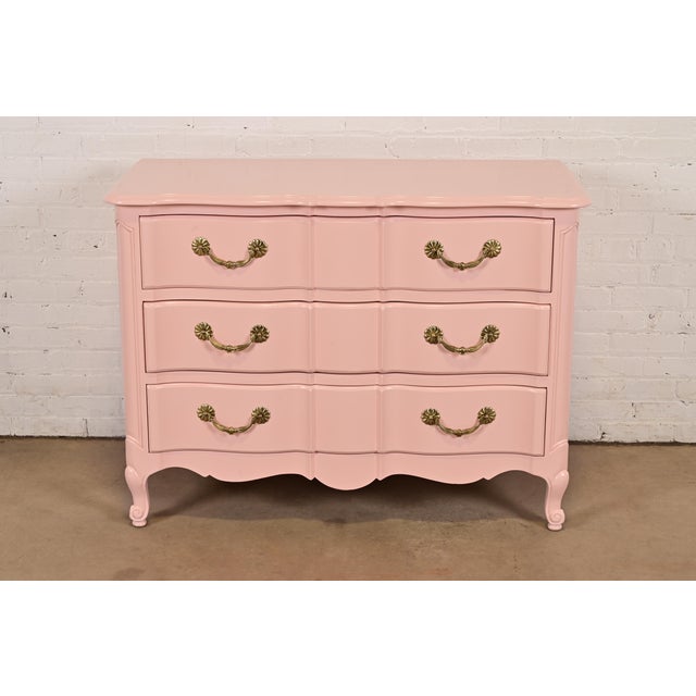 A beautiful French Provincial Louis XV style three-drawer dresser or chest of drawers By Jacques Bodart USA, Circa 1960s...