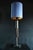 A retired giant machine tap made into a table lamp. All the teeth are worn and pose no threat to touch. An industrial...