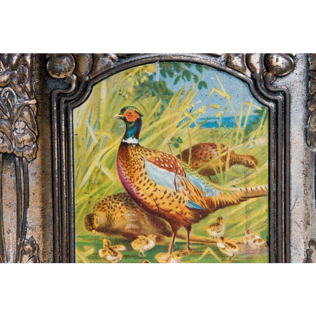 Depicting wild game framed in molded foliate devices. Double lid. Decorate English tin / Colman's Mustard. Early 20th...