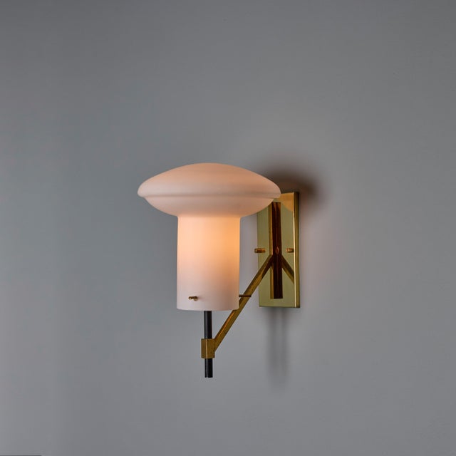 Pair of 1970s Sculptural Glass and Brass Sconces Attributed to Ignazio Gardella Executed in opaline glass with a polished...