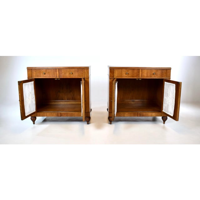 A pair of Mid 20th Century French Regency style Walnut nightstands with striking fiery wood grains, single drawer, two...