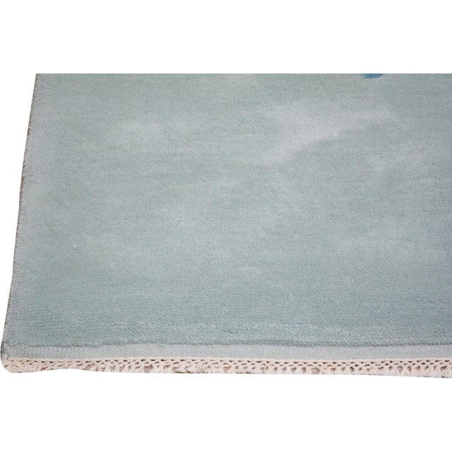 Hand-knotted with care using traditional rug-making techniques, this wool rug blends timeless craftsmanship with a modern...