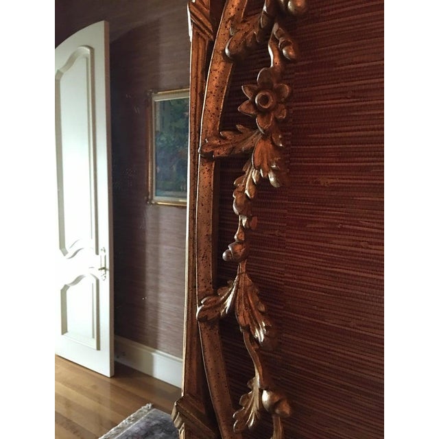 Giltwood Mirror Decorated with Scrolls and a Phoenix Finial, 20th Century. Great detail all around