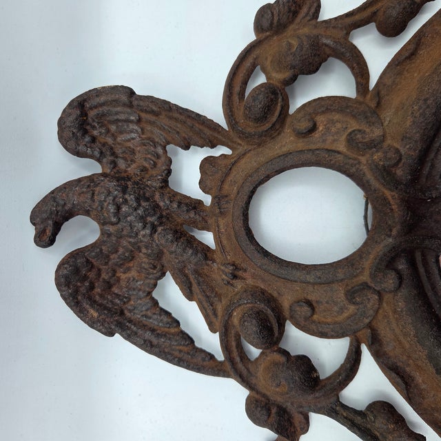 This scarce Civil War-era cast-iron patriotic frame features a spread-wing American eagle, scrolling foliage, draped...