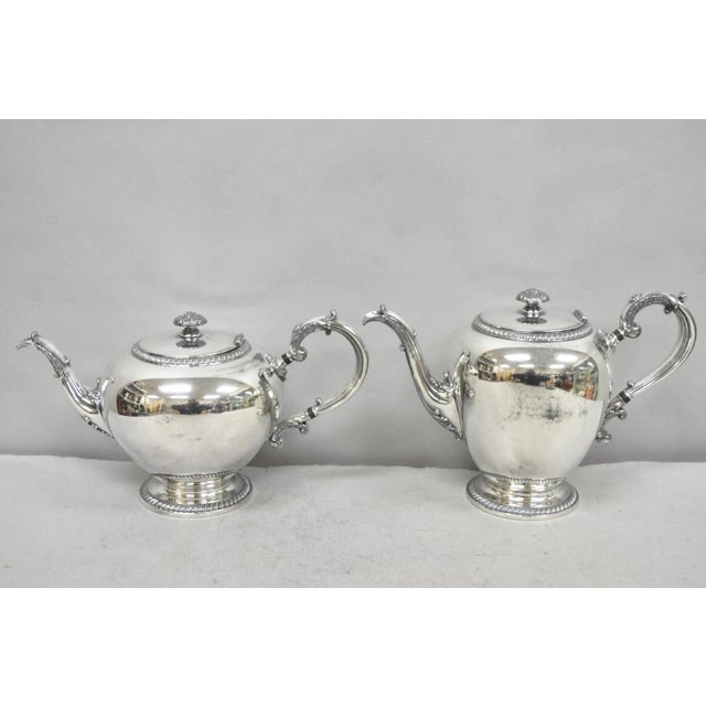 Antique Reed & Barton 4090 Silver Plated Victorian Tea Service - 5 Pc Set. Set includes (1) teapot), (1) coffee pot, (1)...