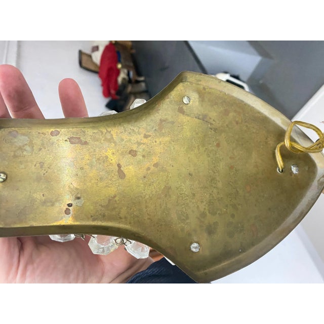 Sconce in metal, glass and brass. It is in a gold color. It has been done in France in the early 20th century. Up to 250V...