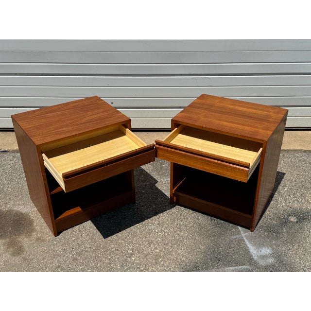 Pair of Mid-Century Danish Modern 1-Drawer Teak Nightstands/End Tables Offered is a piece of time and design: a Pair of...
