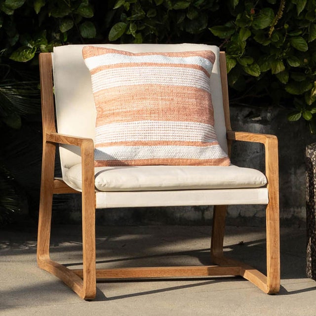 Outdoor hand woven PET yarn pillow with beautiful terra cotta and white striped design. Fill is 100% polyester fiber.