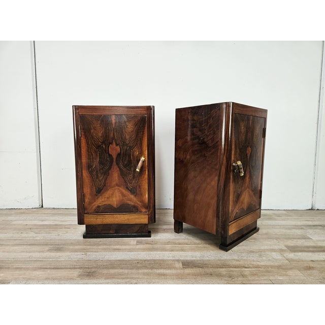 A splendid pair of original Art Deco bedside tables from the 1930s, crafted from fine walnut burl and featuring an elegant...