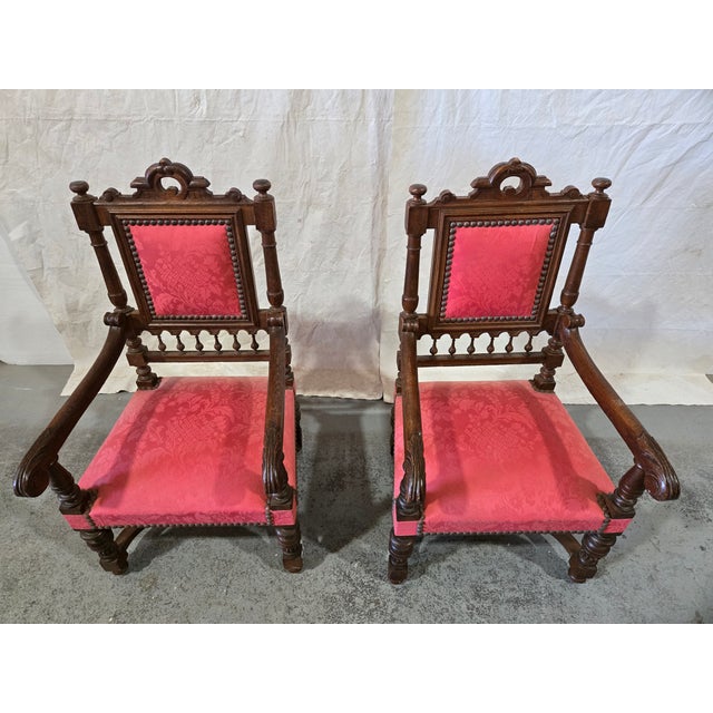 This striking pair of Renaissance Revival armchairs dates to the late 19th century and showcases classic Old World...