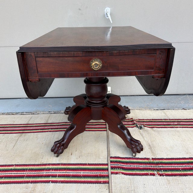 Antique Philadelphia Neo-Classical Mahogany Drop Leaf Breakfast Table, Stamped "H.W", Circa 1810s An exceptional and...