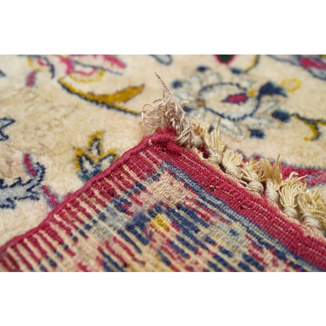 Always finely woven and favoring cream fields, Isfahan rugs, as here, show pendanted round medallions supported by...