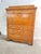 A classic early 19th-century Biedermeier writing secretaire featuring clean architectural lines and a beautiful honey-...