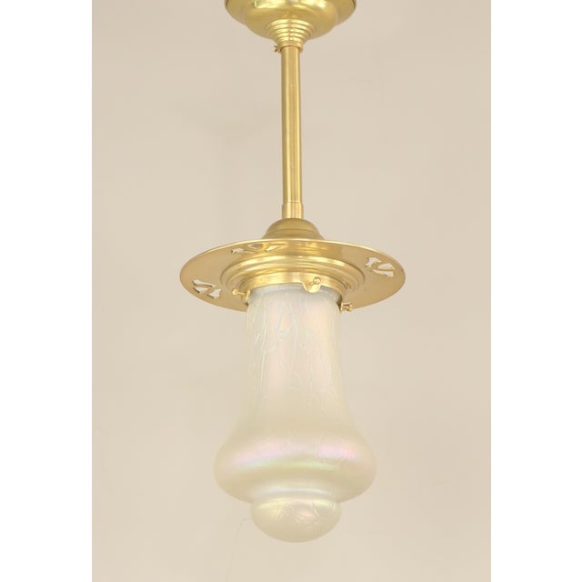 Beautiful antique pendant lamp from Vienna. The fixture is made of solid brass with a polished finish, complemented by a...