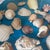 Noah’s Ark Coastal Centerpiece: Woven Boat Basket Overfilled With Sea Shells For Sale - Image 10 of 11