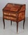 An 18th Century Louis XV French marquetry bureau de pente, or slant front desk, made with veneers of mahogany, rosewood...