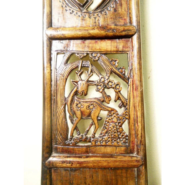 This style of chair is known as "official's hat chair" because the projections over the rear stiles resemble the knobs on...