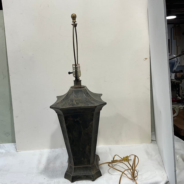 Solid heavy metal/tole faux painted single table lamp features pagoda shape with earthy dark green, hints of rust and...