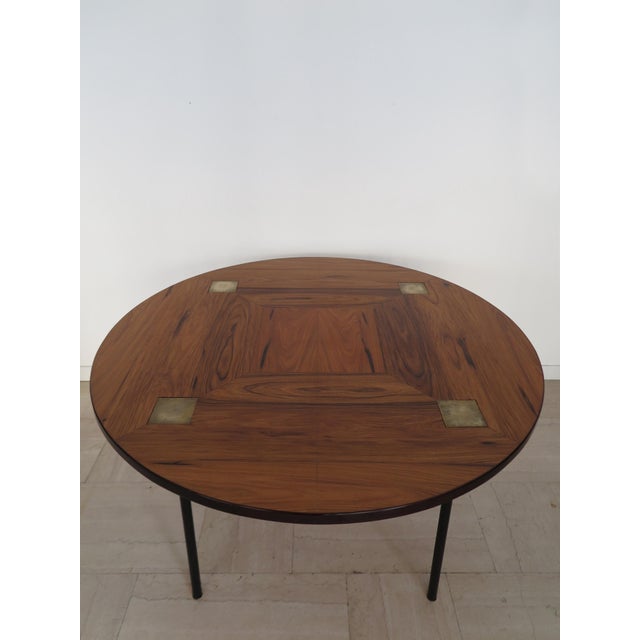 Italian table designed by Ettore Sottsass (1917-2007) and produced by Poltronova Firenze, with an inlaid wood top and...