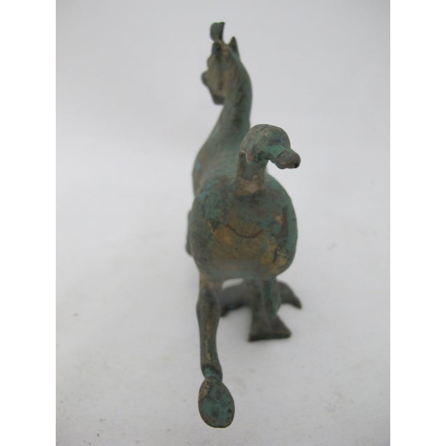 Vintage Chinese Han Dynasty style bronze sculpture of the Flying Horse of Gansu, in heavy green verdigris patina. Comes...