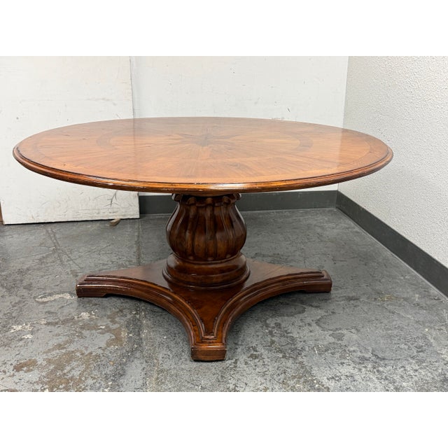 Design Plus Gallery presents a Starburst Pedestal Dining Table by Woodland Furniture. The circular top showcases radial...