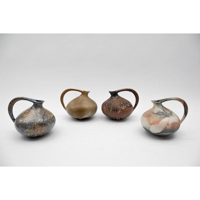 Set of 4 Pottery Vases "313" Designed by Kurt Tschörner Ruscha, Germany, 1960s Very good condition. This piece has an...
