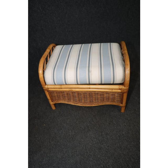 Bamboo and Wicker Upholstered Ottoman, stripe upholstered cushion, bamboo frame with woven wicker panels.