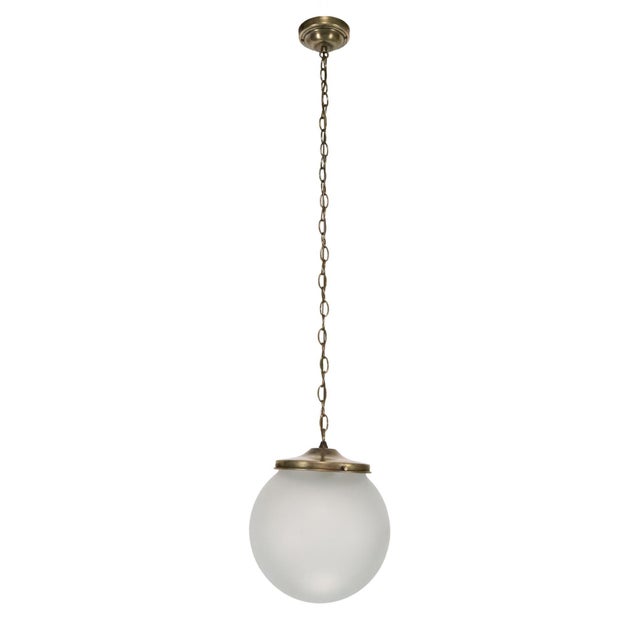 Mid Century Modern style pendant light with a vintage frosted glass globe paired with a newly made antique brass chain...