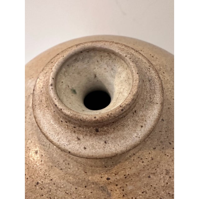 A large handmade ceramic vessel by the late Stephen May, celebrated for his refined forms and earthy glazes. Originally a...