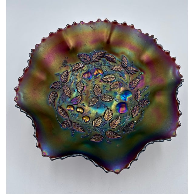 Discover the enchanting beauty of this vintage Northwood Amethyst Carnival Glass Footed Bowl, featuring the iconic Three...