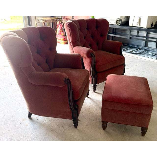 The style of these beautiful armchairs, with their carved wood and tufted upholstery is characteristic of the Napoleon III...