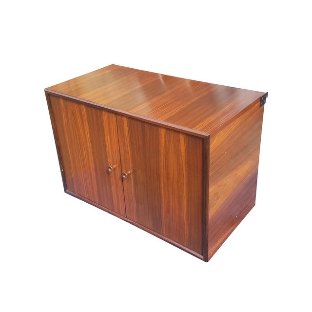 This bookcase was produced in Italy around the 1960s. It consists of a wall panel with 2 adjustable containers and 1 desk...
