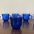 Vintage 1950s cobalt blue glass coffee mugs in a sunflower design produced by Forte Crisa in Mexico.