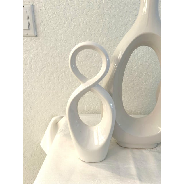 Contemporary set of three organic modern design white ceramic sculptures each in a different design. Excellent condition....