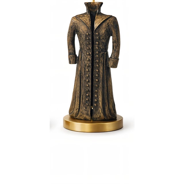 This striking pair of sculptural table lamps is crafted from bronze and represents stylized, headless 19th-century coats,...